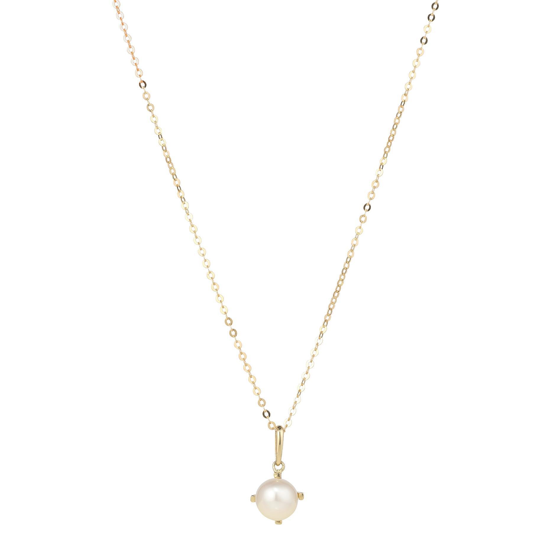 A 9kt gold necklace with a fresh water pearl pendant, designed in Dublin and hallmarked in Assay Office, Dublin Castle.