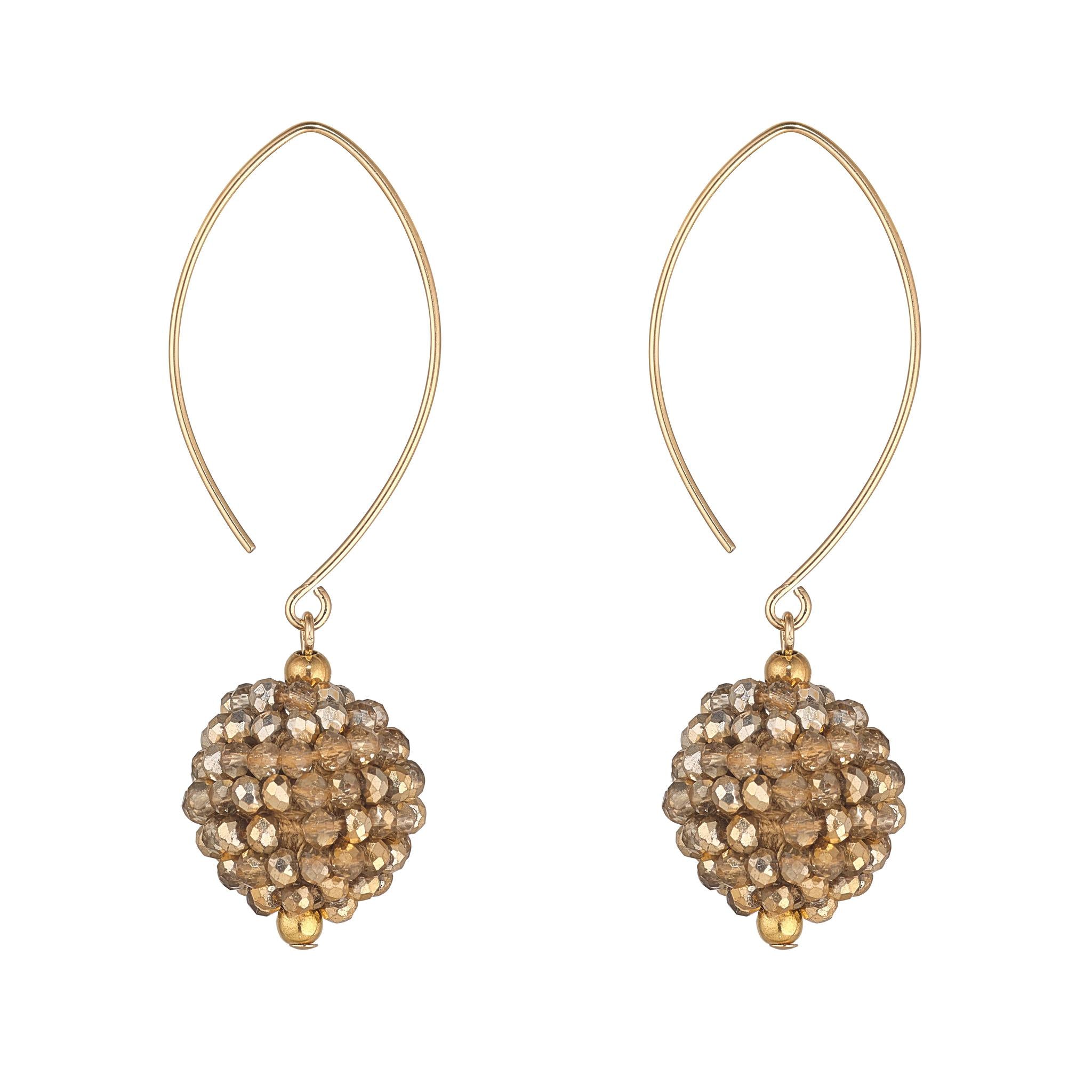 A pair of gold-filled oval earrings with a small cluster of mocha-colored beads attached to them.