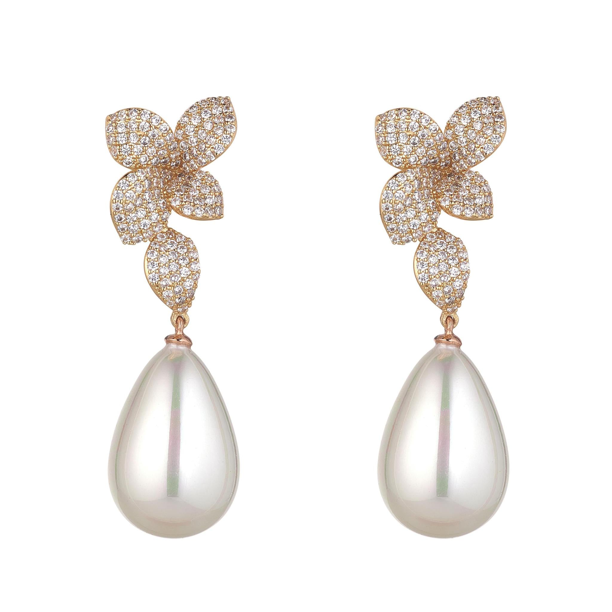 A pair of gold-plated earrings featuring cubic zirconia in floral drop designs with large pearl accents.