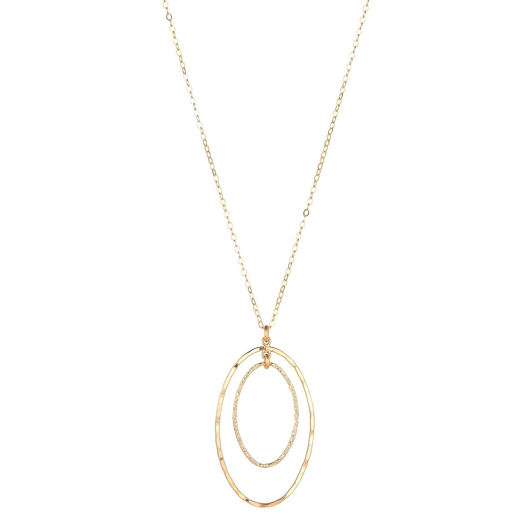 A gold-filled textured double oval pendant necklace on a chain.
