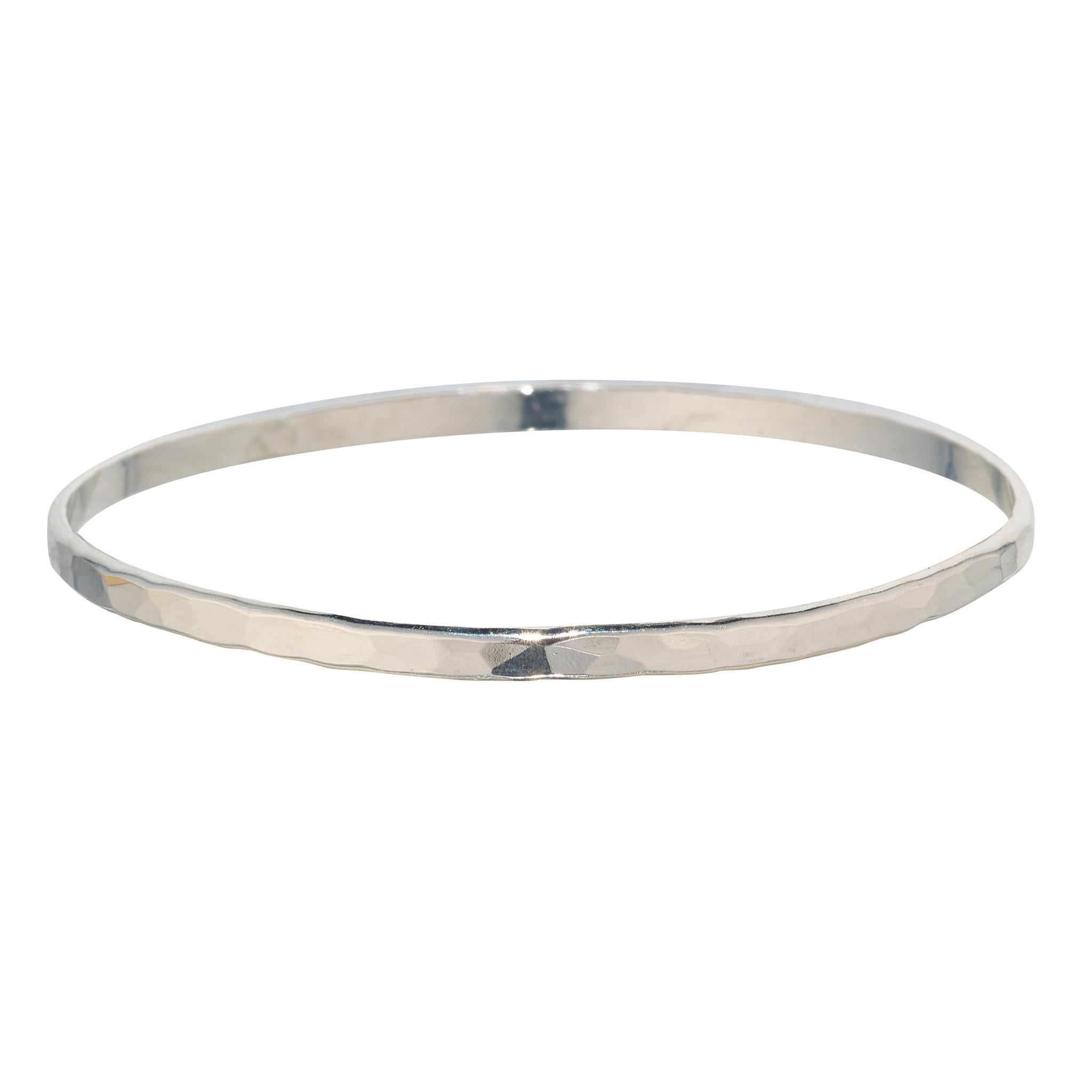 Silver bangle on a white background