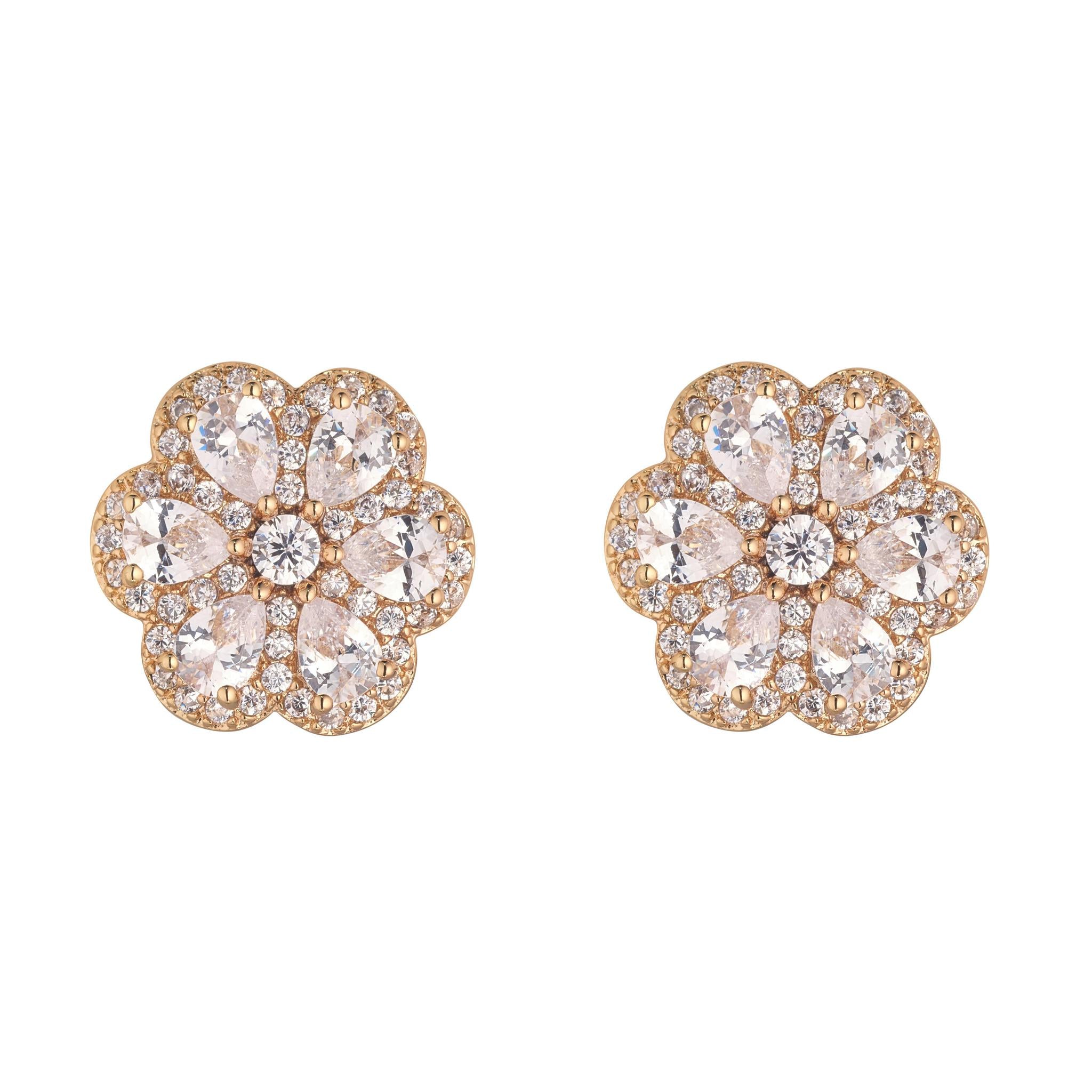 A pair of gold stud earrings featuring a floral design with cubic zirconia stones.