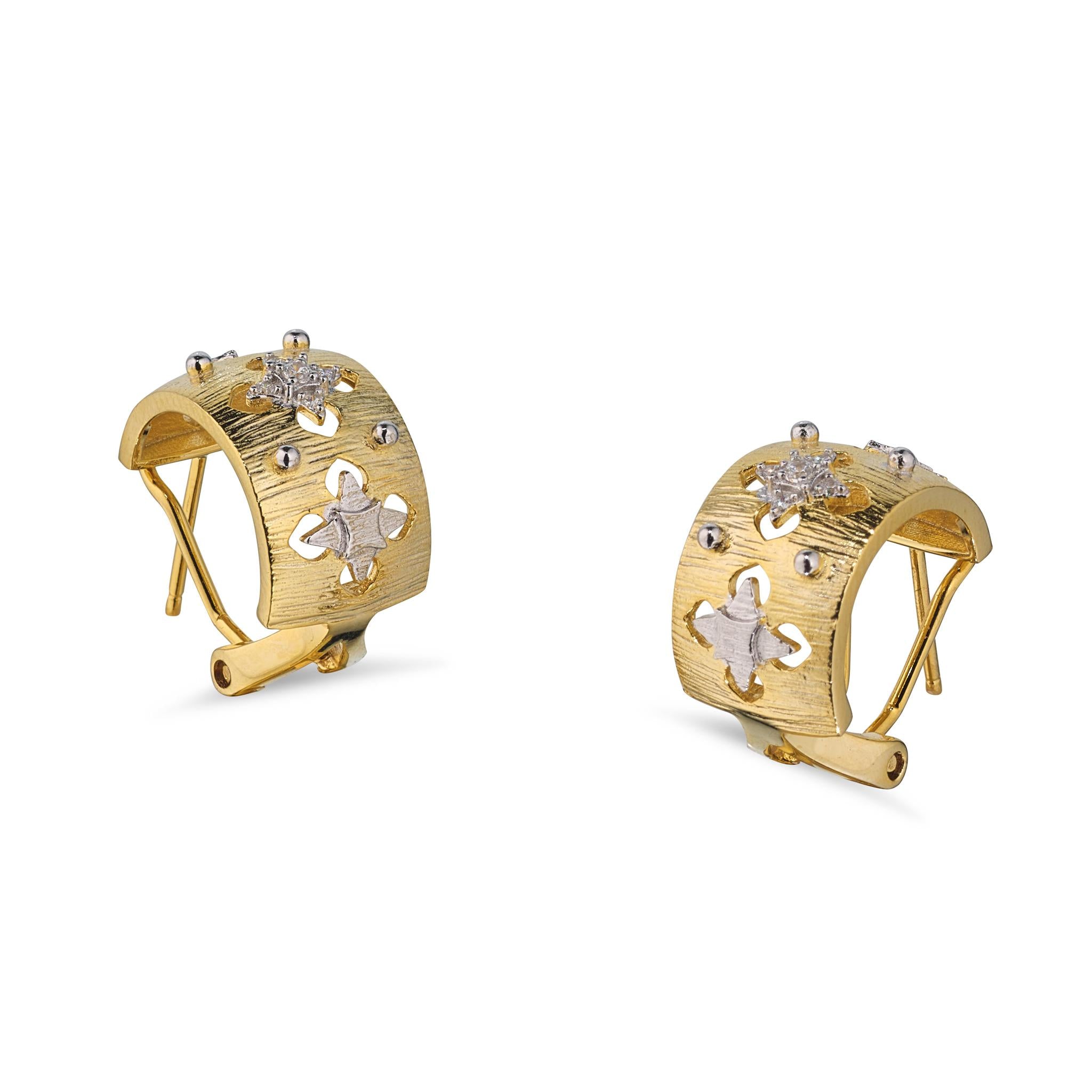 A pair of gold-plated hoop earrings with floral designs