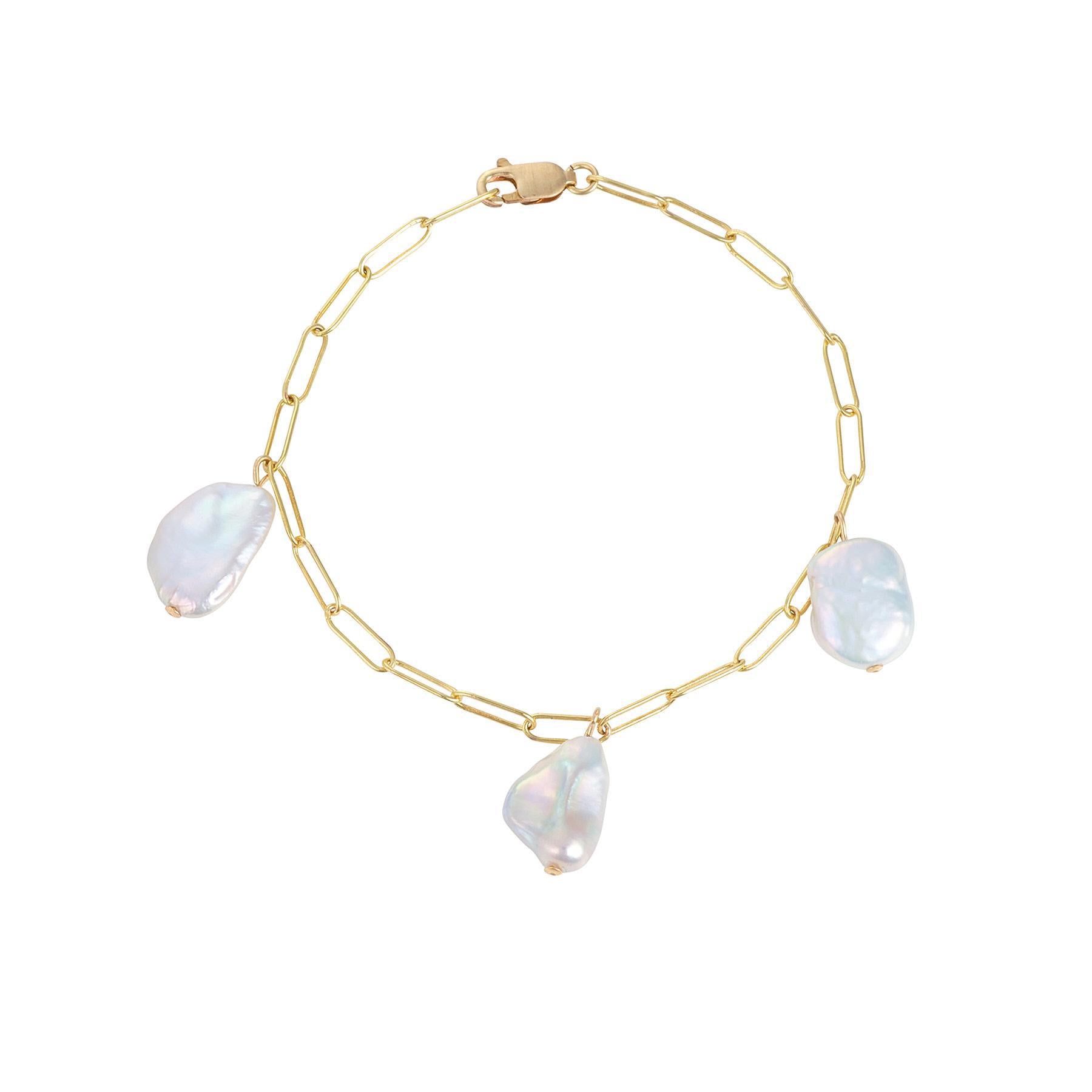 A gold-filled bracelet with a paperclip chain design and three flat baroque pearls.