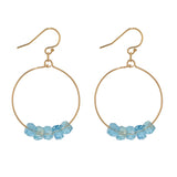 Gold filled hoop earrings with aquamarine crystals