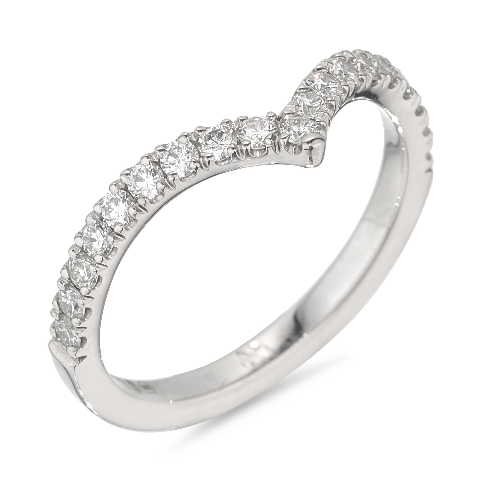 A platinum ring featuring a wishbone design with natural diamonds