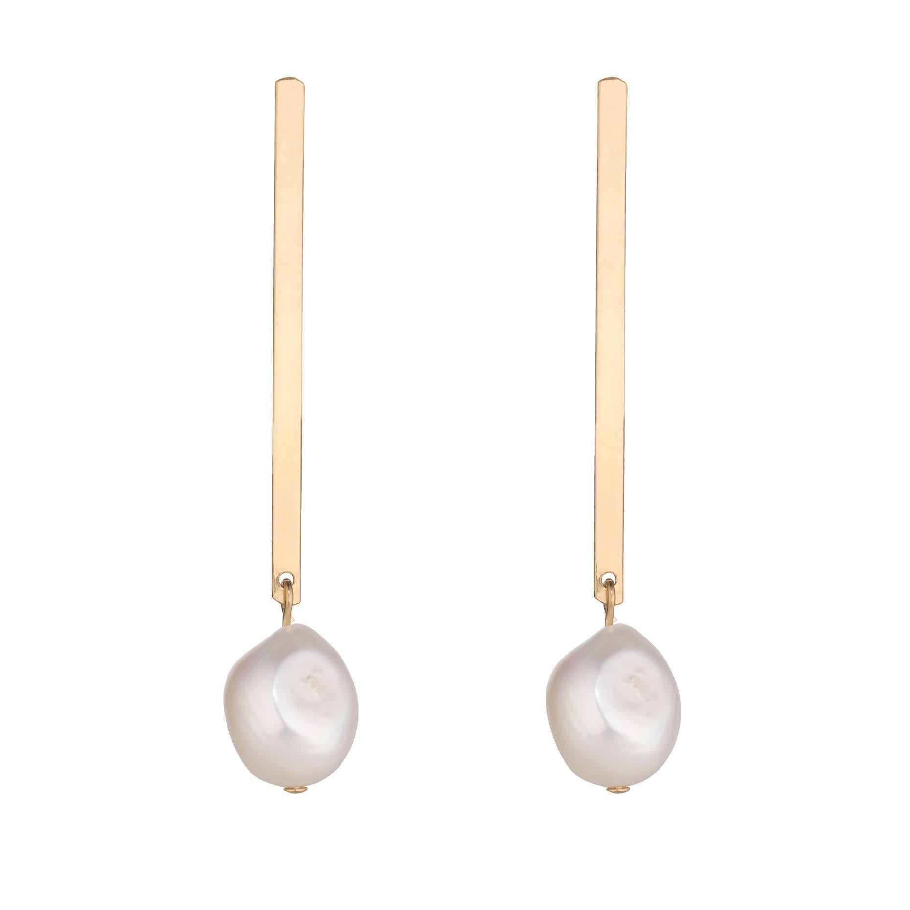 A pair of gold-filled flat bar earrings with baroque pearl drops.