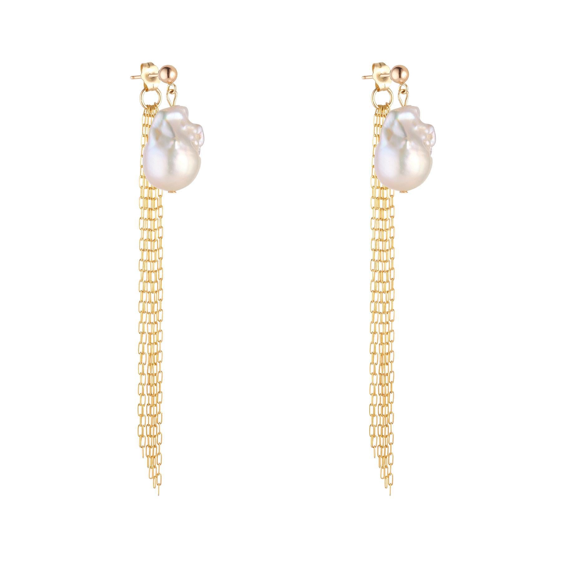 A pair of gold-filled earrings featuring large baroque pearls with dangling gold fringe chain.