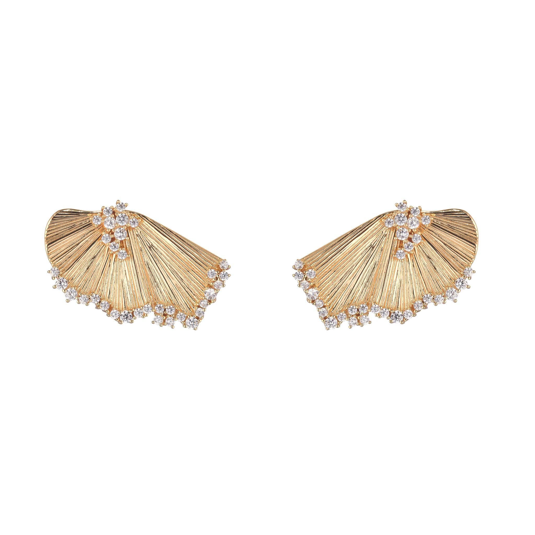 A pair of gold-plated large fan-shaped stud earrings with intricate details and small embellishments.