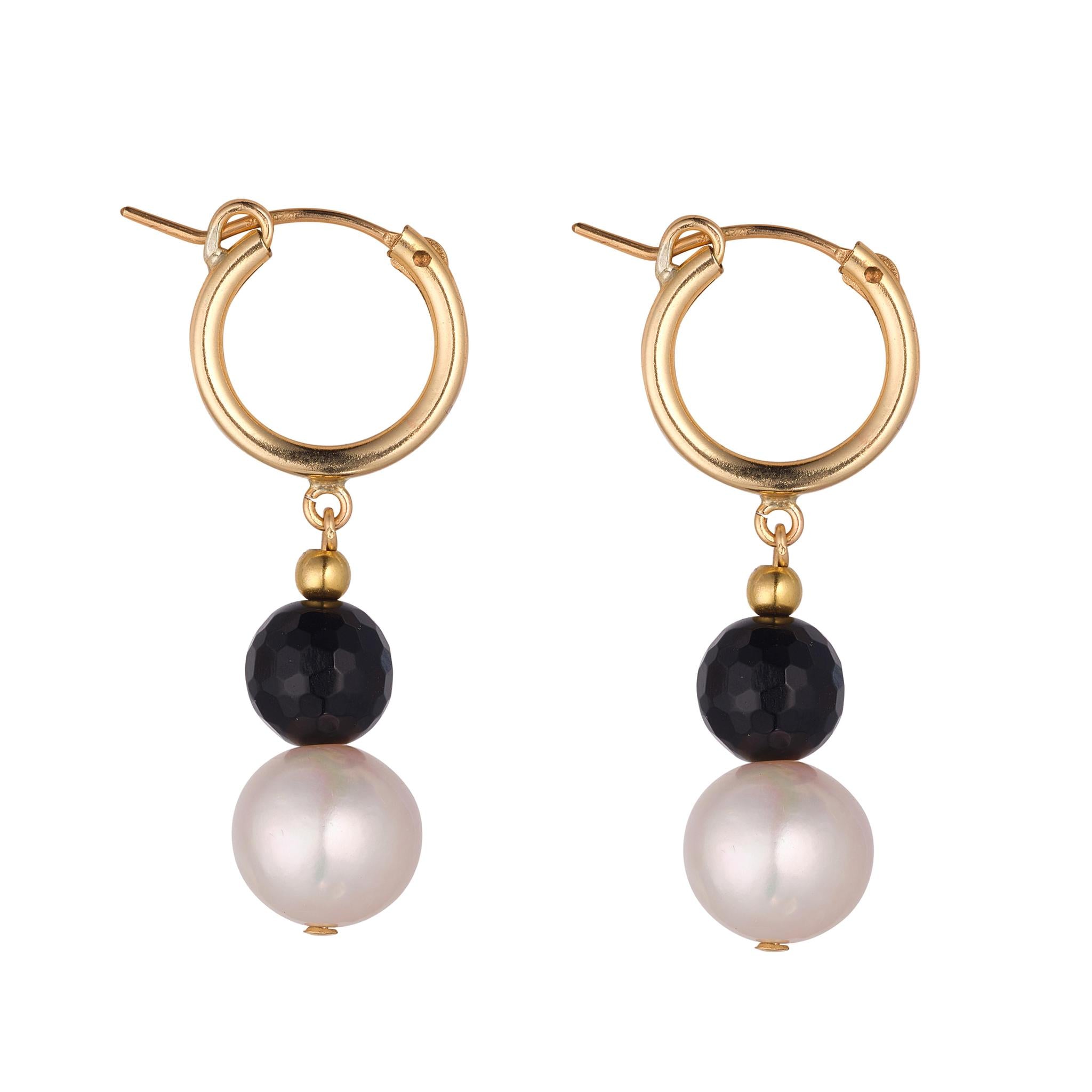 A pair of gold-filled clip hoop earrings with a fresh water round pearl and black agate bead drop
