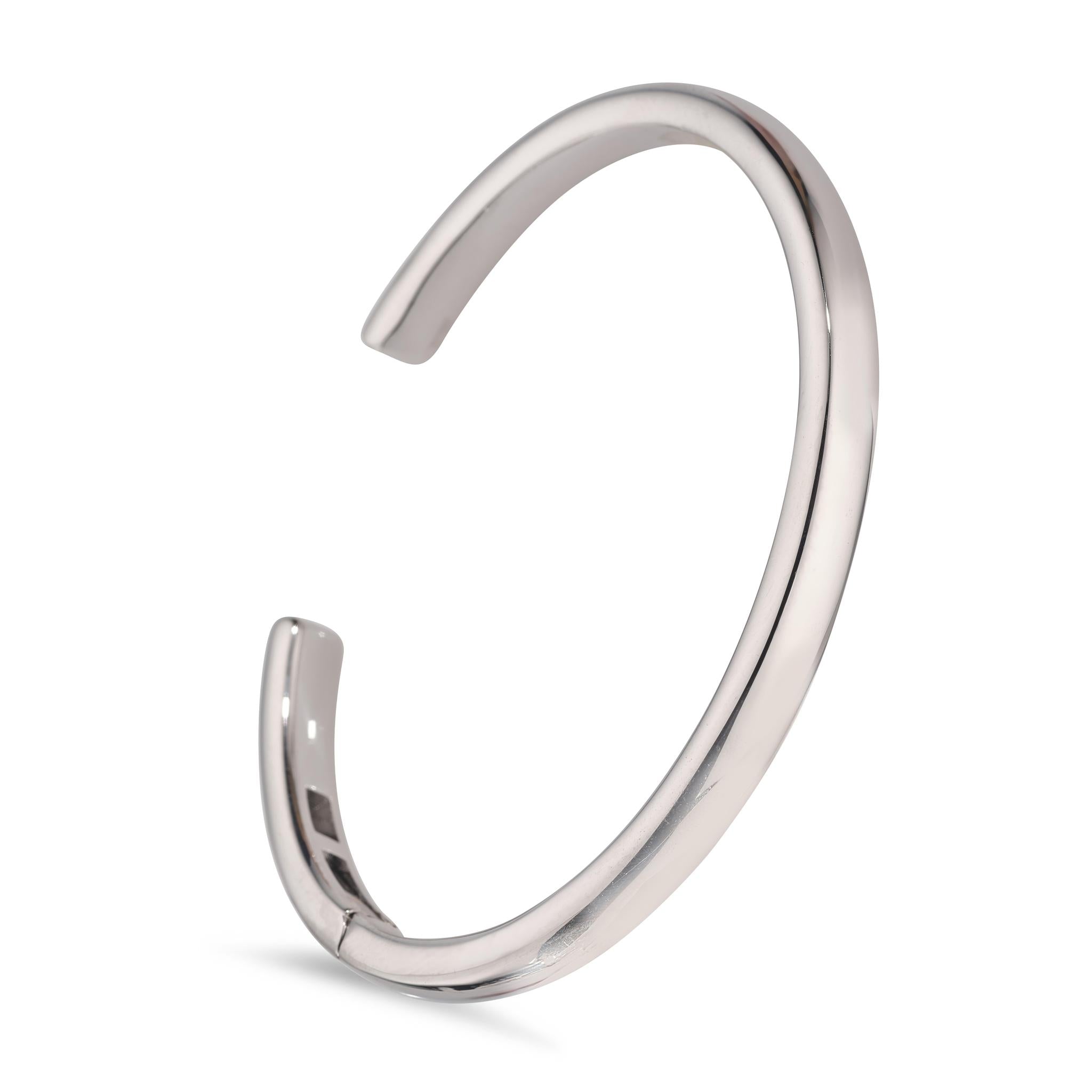 A rhodium plated open hinged bangle bracelet.