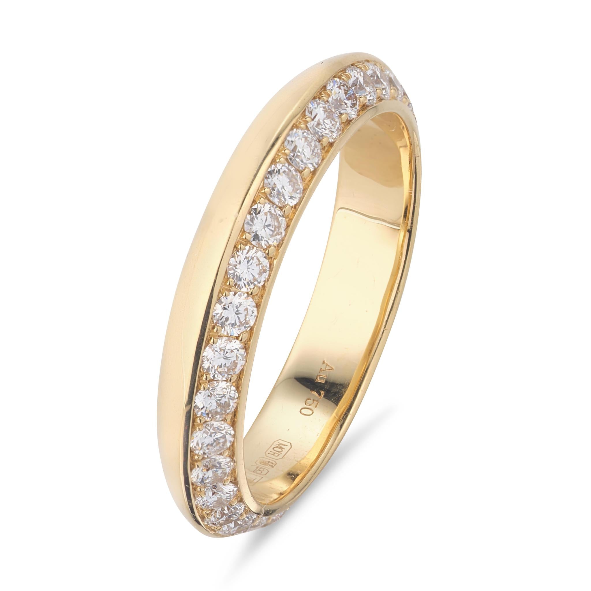 An 18kt yellow gold ring with diamond accents, designed and hallmarked in Dublin.