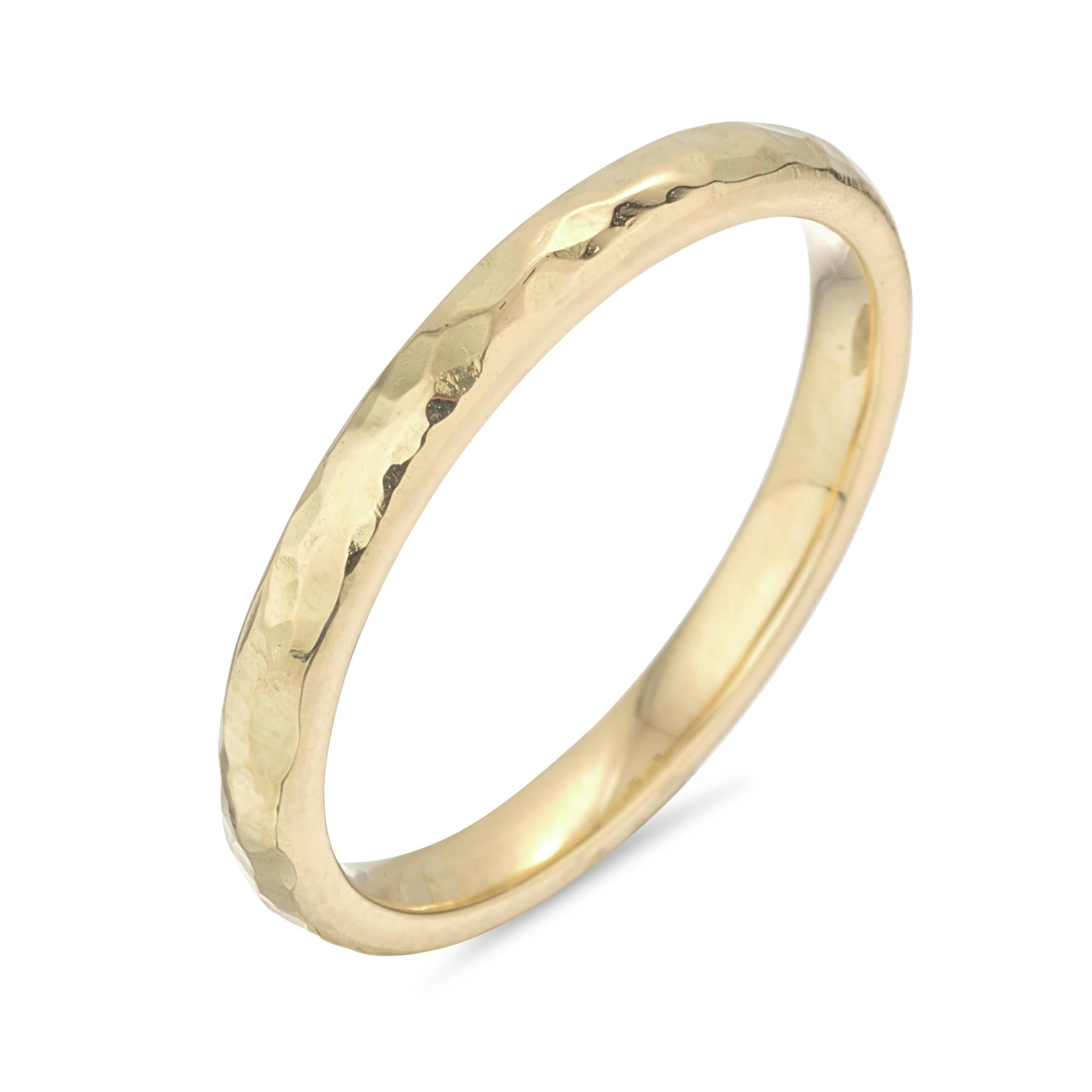 A 18kt yellow gold ring with a textured finish.