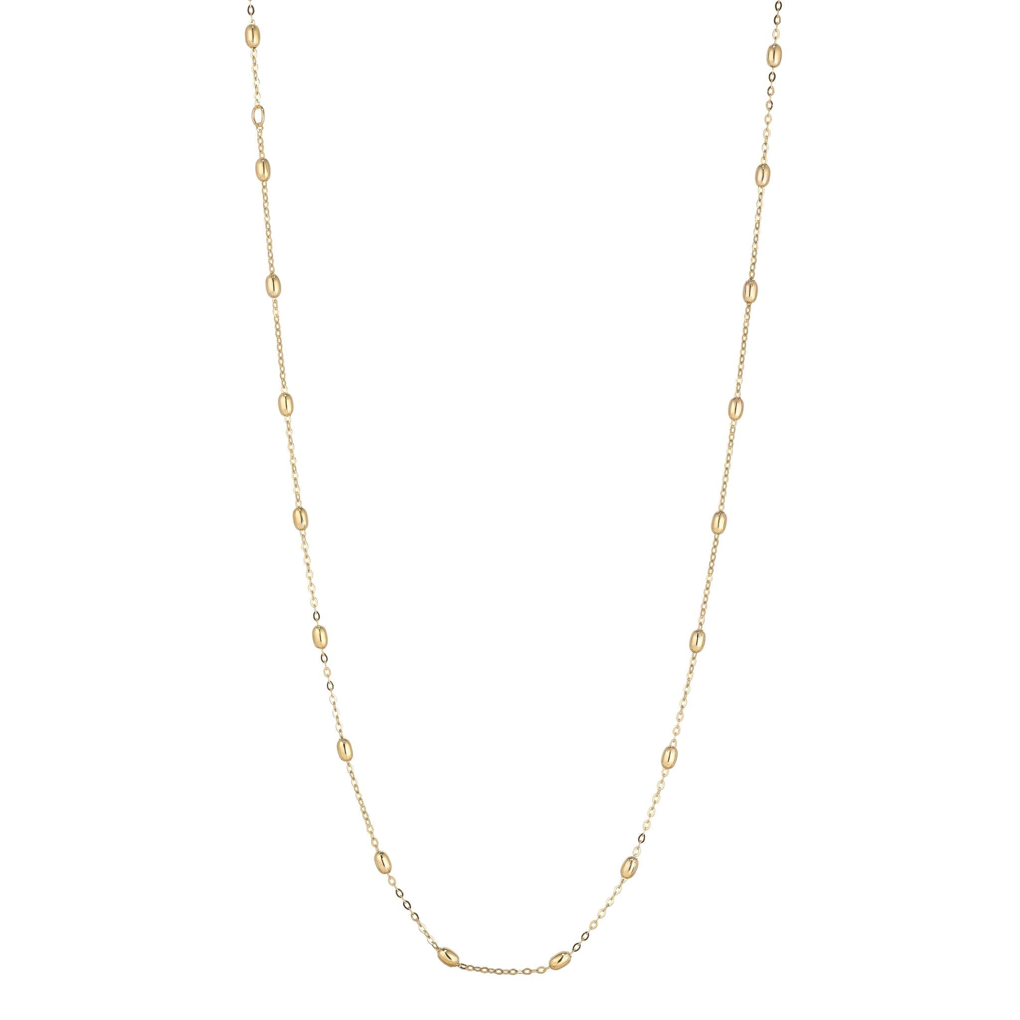 A gold-filled satellite bean necklace measuring 20 inches in length.
