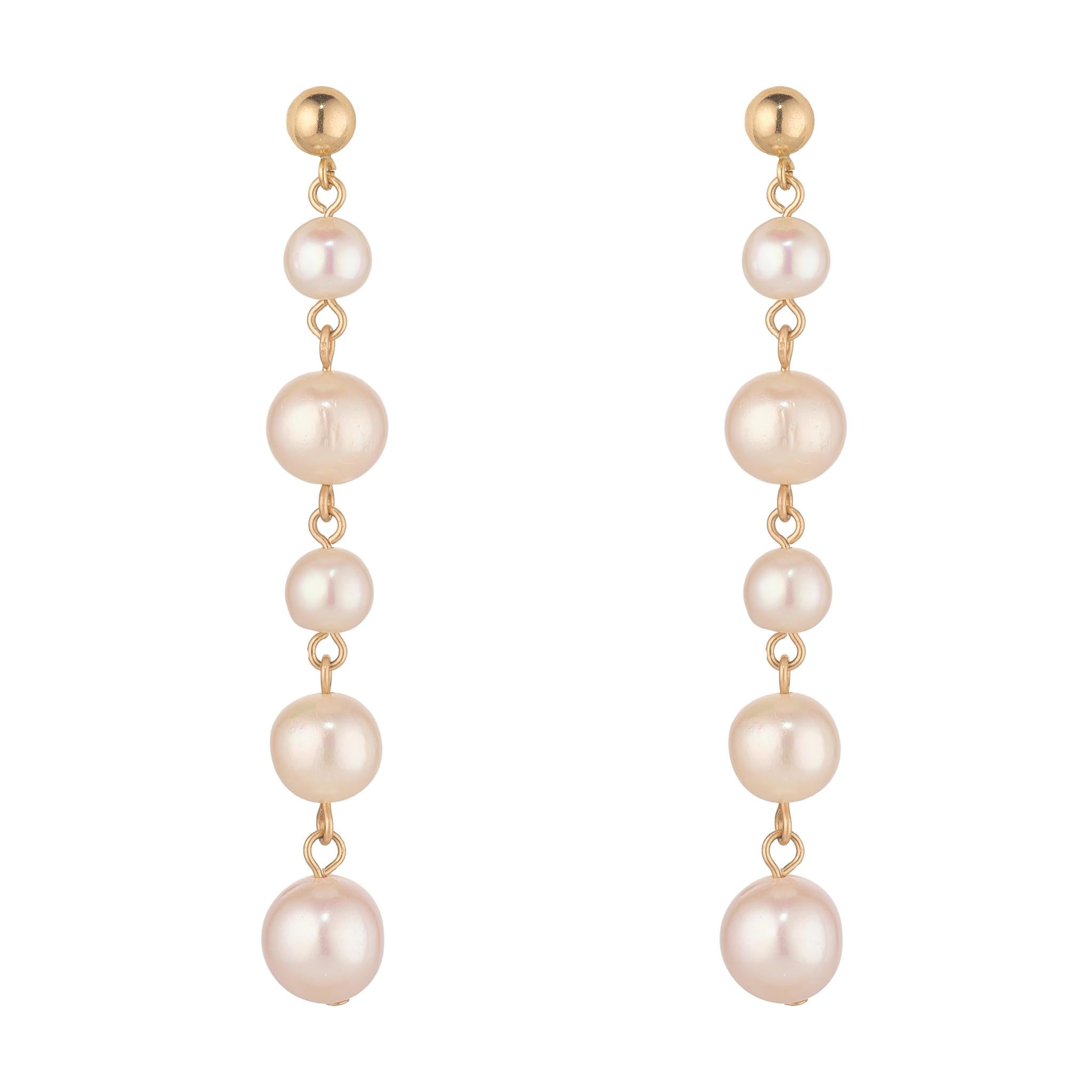 Pair of five fresh water pearl earrings with gold ball post.