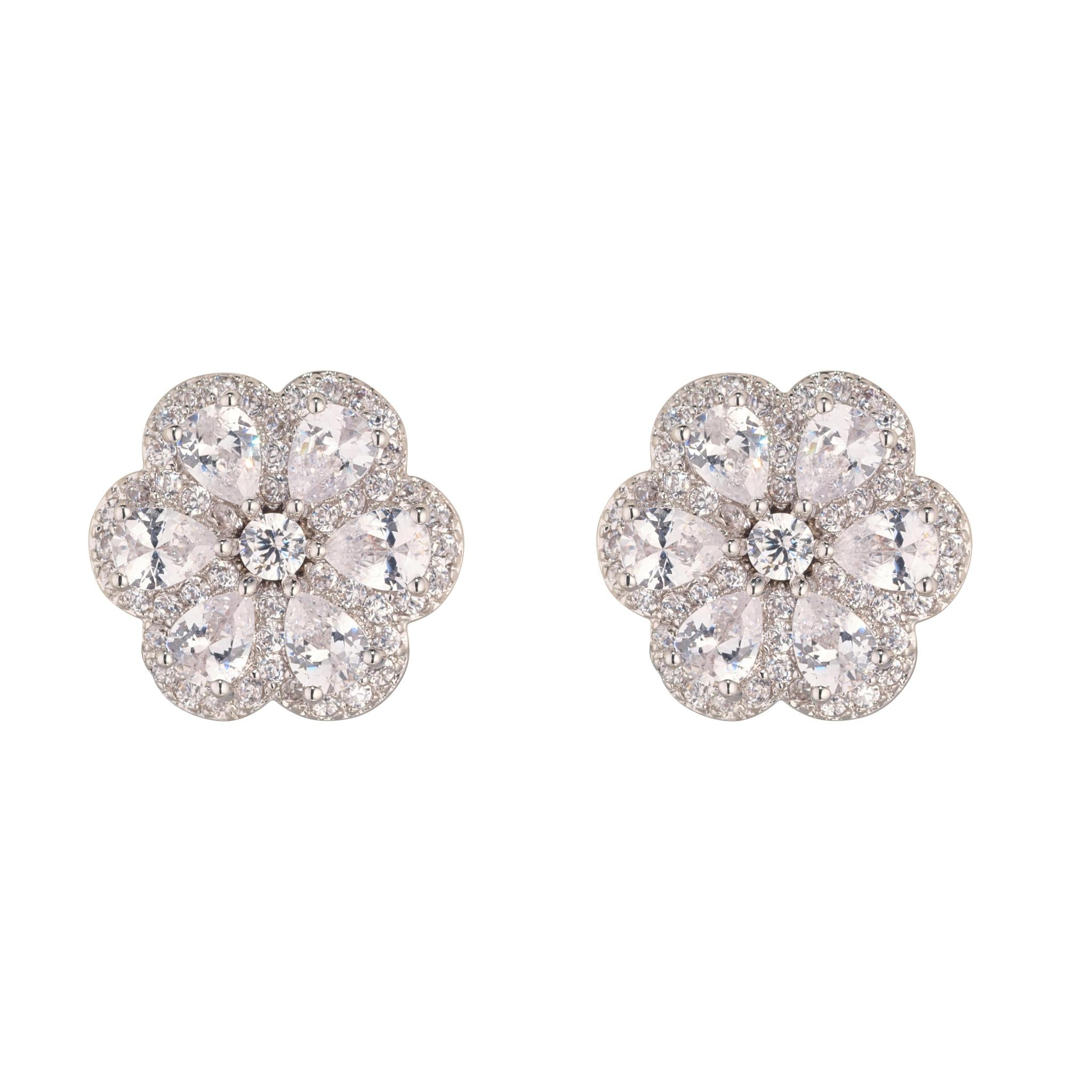 A pair of white camillia small stud earrings with rodium plating on brass and cubic zirconia stones.
