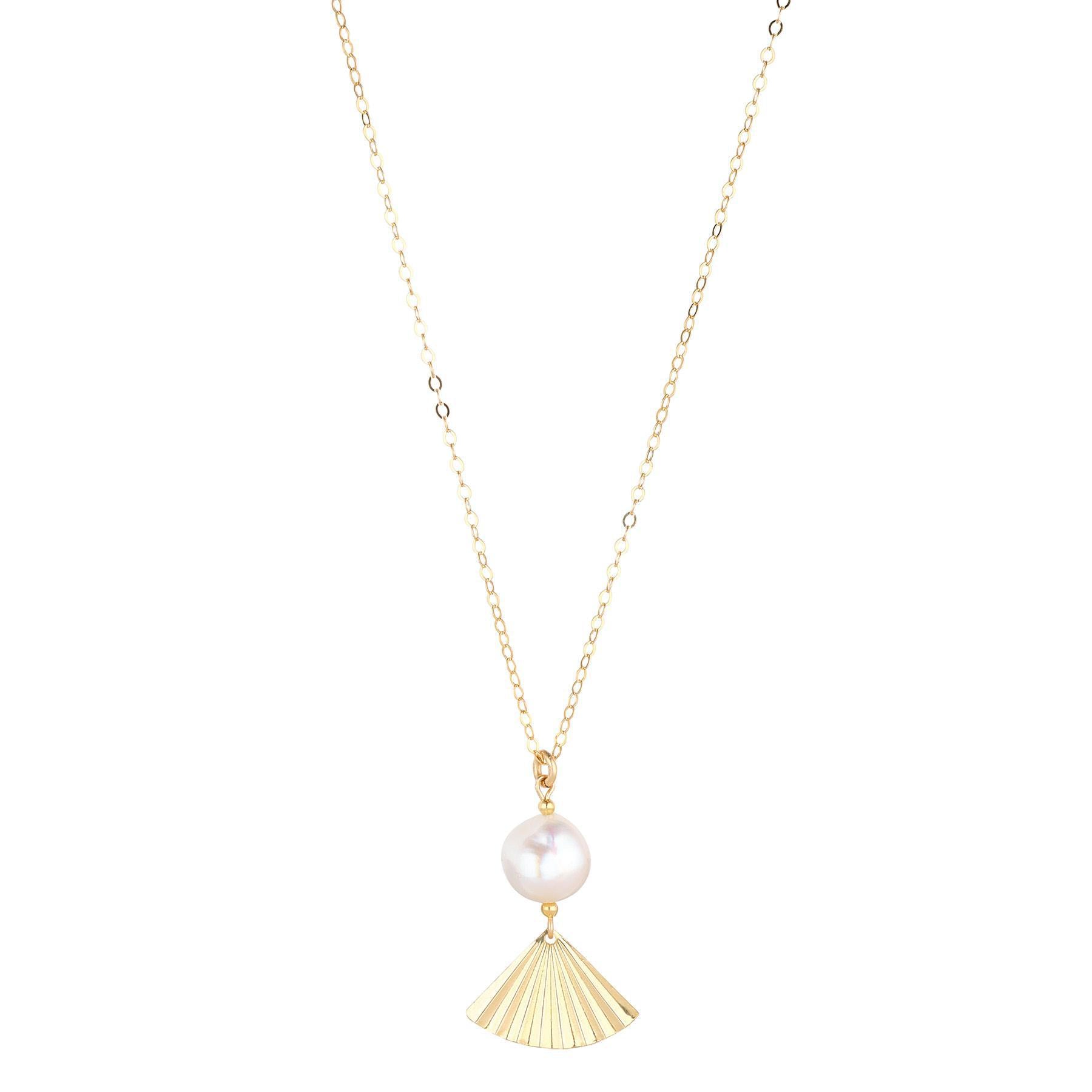 A gold-filled pendant necklace featuring a baroque pearl and a gold fan design.