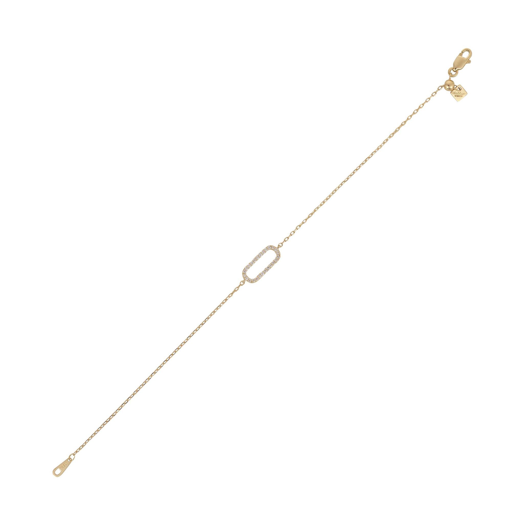 A 18kt gold & diamond oval bracelet on a white background.