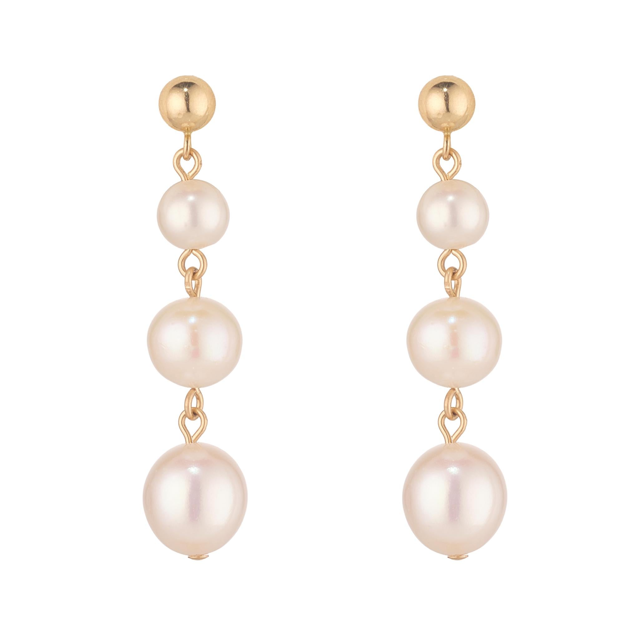 Pair of three fresh water pearl earrings with gold ball