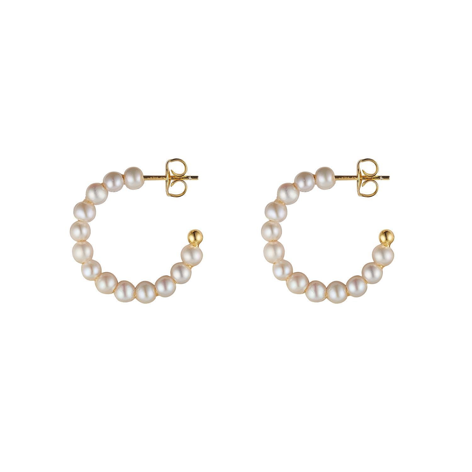 A pair of gold plated pearl stud hoop earrings with small freshwater pearls arranged in a hoop shape.