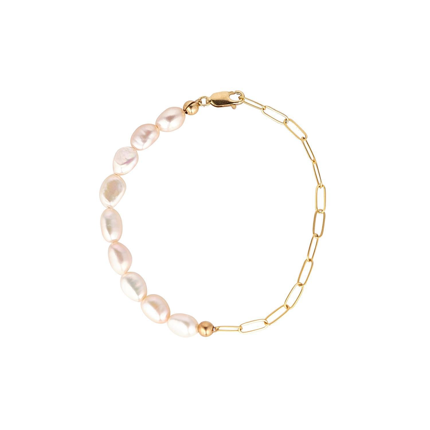 A gold filled bracelet featuring a chain link design with baroque pearls in a white hue, displayed against a white background.