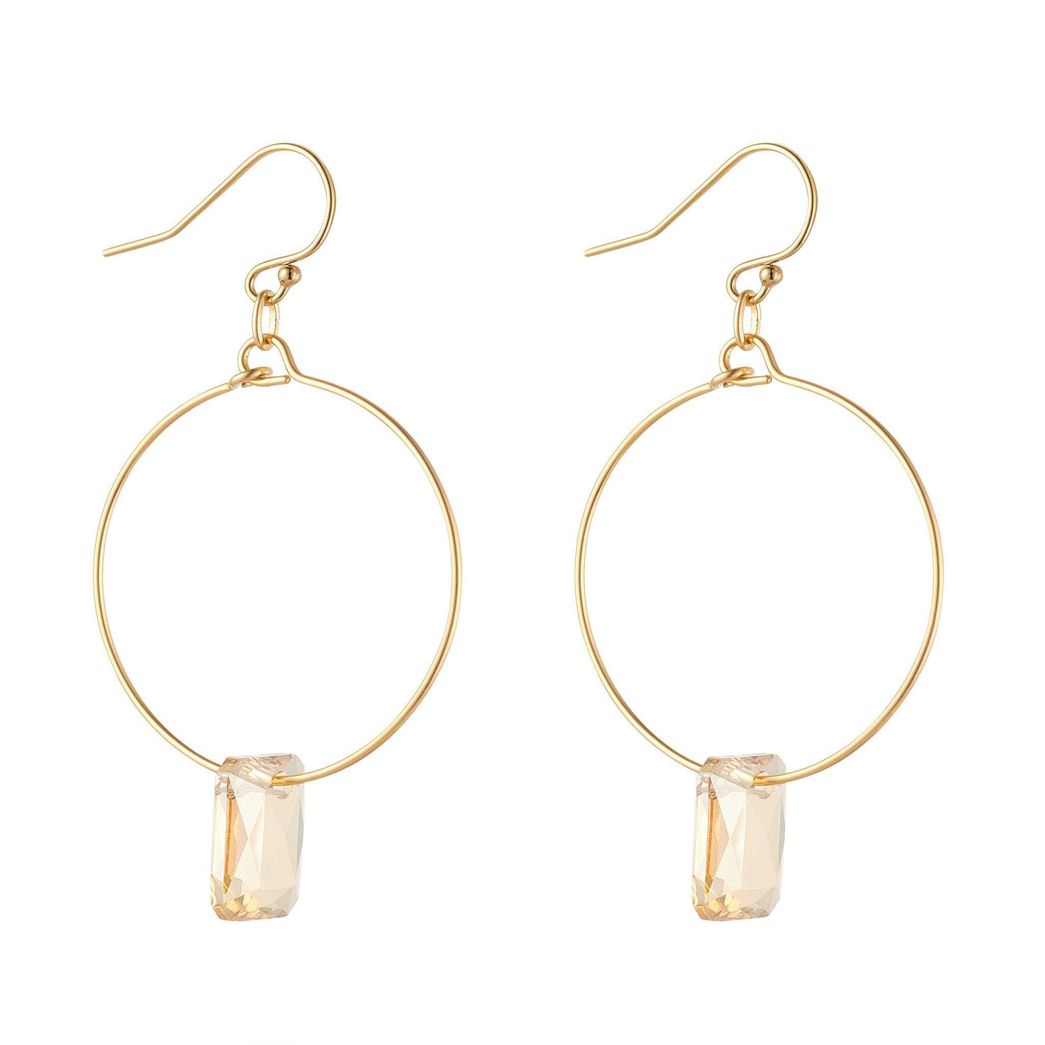 A pair of gold-filled hoop earrings with emerald cut crystal elements.