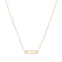 A 9kt gold necklace with a small open rectangle pendant, designed and hallmarked in Dublin, Ireland.