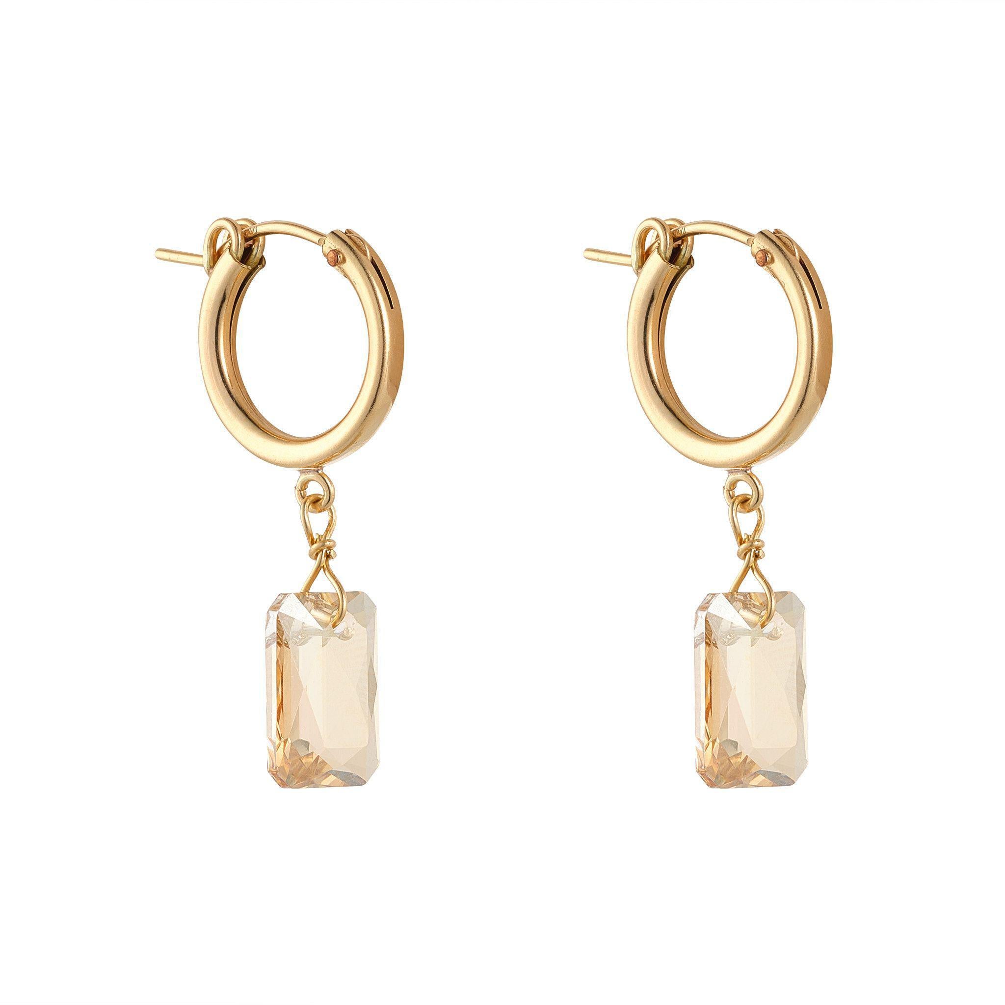 A pair of gold-filled clip hoop earrings with golden shadow emerald cut crystal elements.