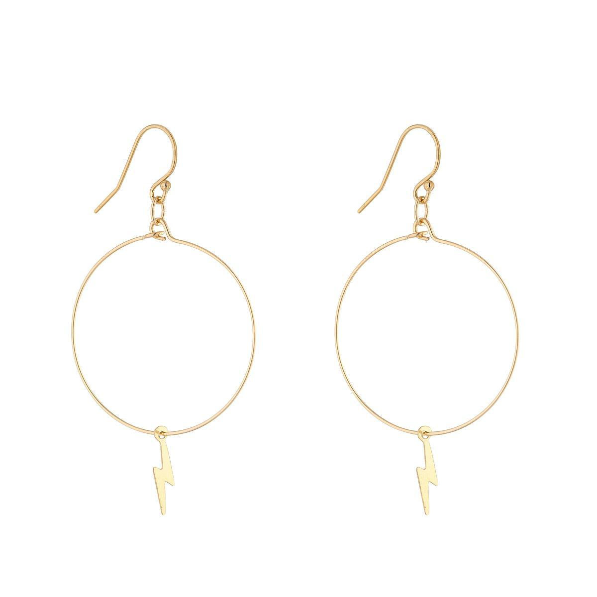 A pair of gold filled hoop earrings with lightning bolt charms attached.