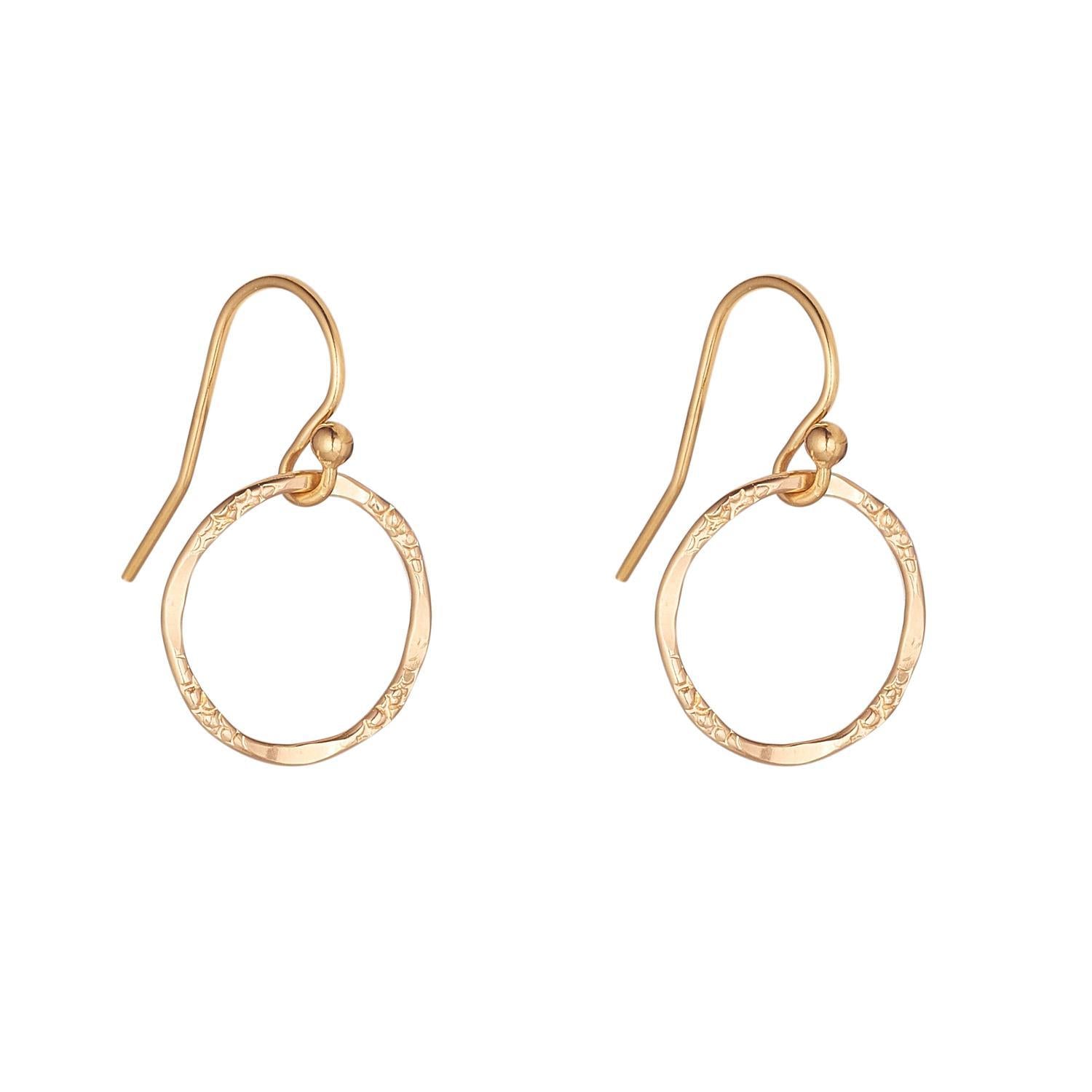 A pair of Large molten circle drop earrings