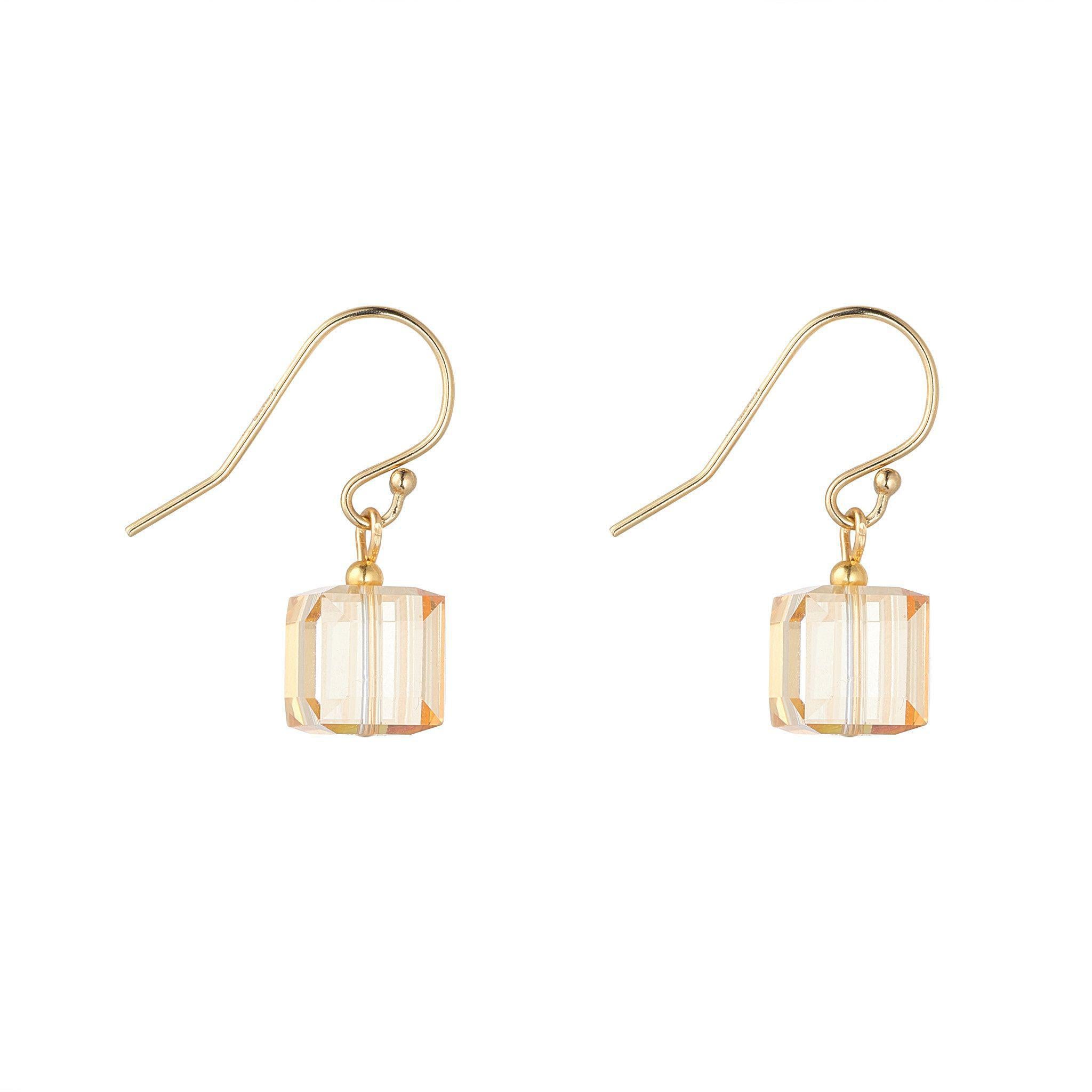 A pair of gold-filled 8mm drop earrings with a golden shadow finish.