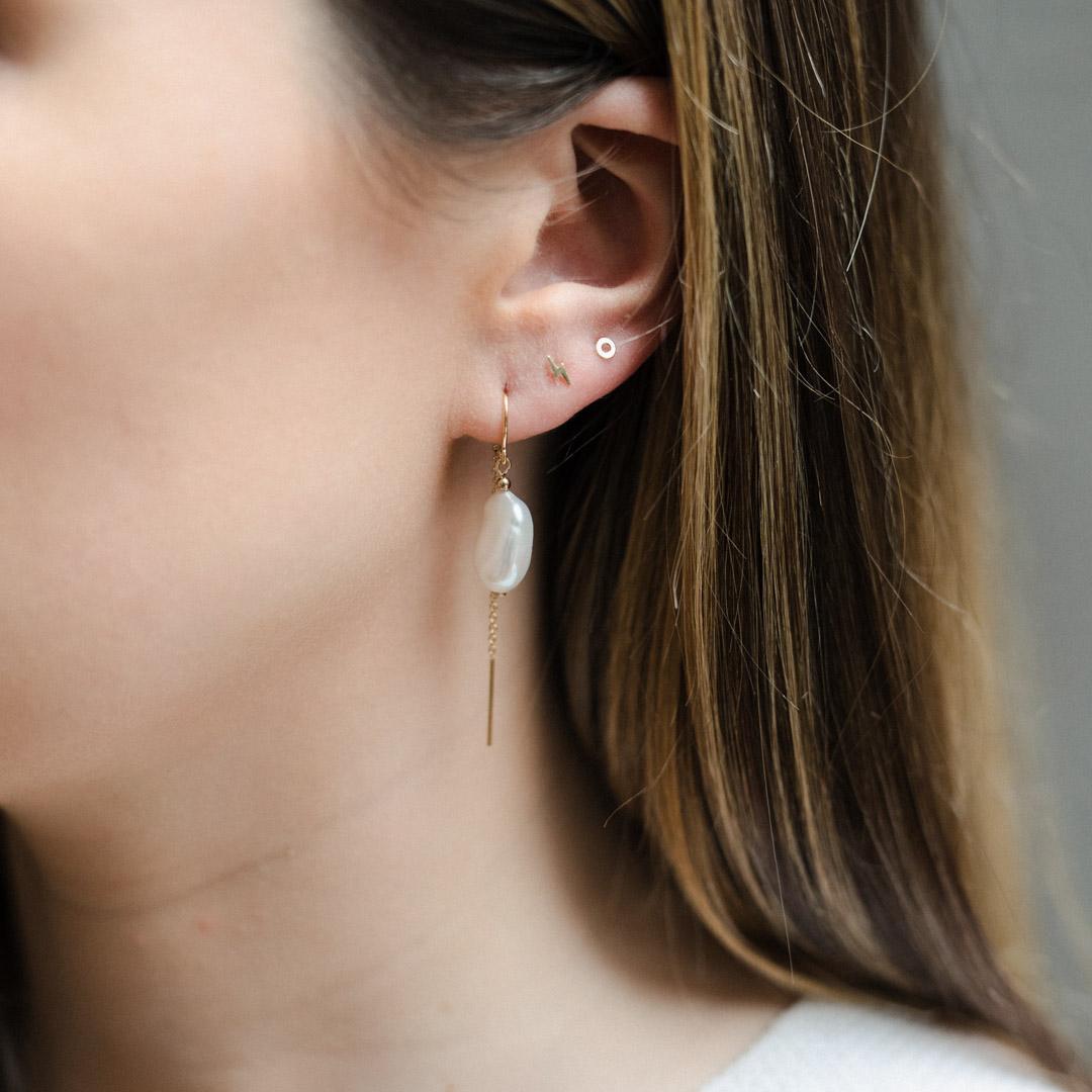A pair of gold filled baroque pearl half threader earrings.