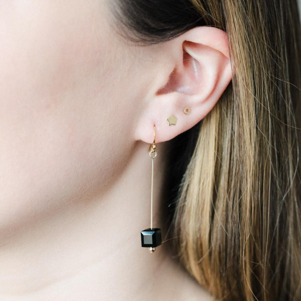 A pair of gold filled black crystal cube pin earrings.