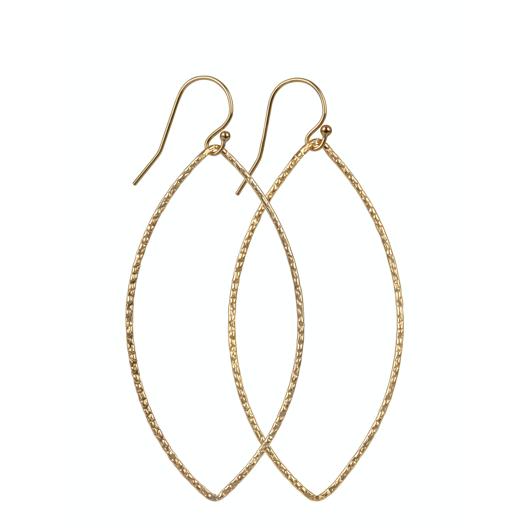 A pair of gold-filled hammered oval earrings with a matte and textured finish, hanging vertically.